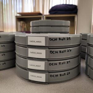 Archival film canisters containing 16mm movie film from the Painted Screen Society of Baltimore collection. Photo by Acadia Roher.